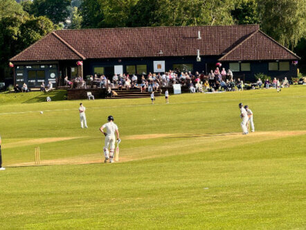 Berkhamsted Cricket Club match in front of pavilion