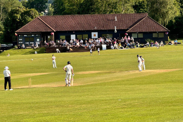 Berkhamsted Cricket Club match in front of pavilion